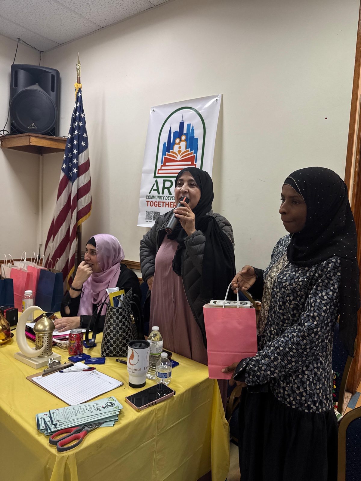 Speakers addressing families at an ARWA community gathering